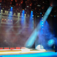 View from the illuminated empty show stage to the dark auditorium